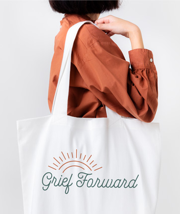 Woman holding bag with Grief Forward logo